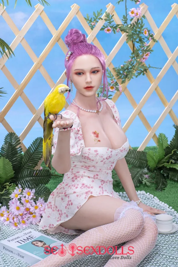 woman having sex with a male sex doll
